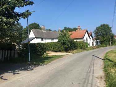 Photograph 1: Chiswick Farm Cottages and Farm House photographed in 2021.  The large conifer by Chiswick Farm House has been felled. | Tim Gane