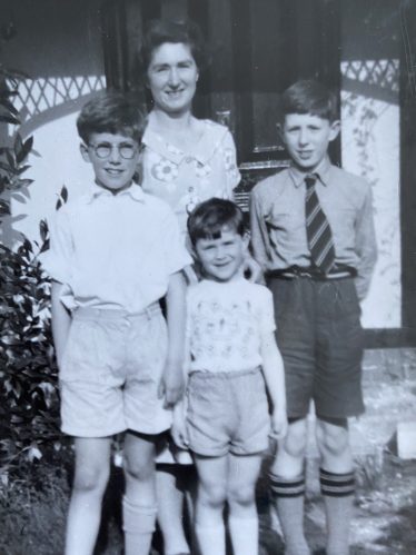 The Pinney Family, 1957, outside Kelston Cottage, 116 High Street, Meldreth. <br>Left to Right: Robert (9), Sheila (mother), Alan (4), David (11) | Alan Pinney