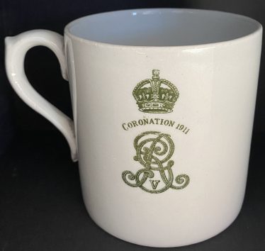 A coronation mug presented by J G Mortlock of Meldreth Court on 22nd June 1911 