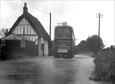 Sheene Cottage 1950s - the gable end and road flooding | Melbourn Local History Group