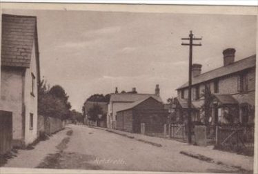 A view of the High Street showing the barn on the right hand side about, 1930