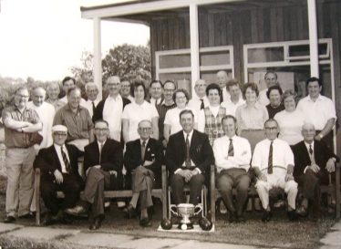 Members of Meldreth Bowls Club, 1972.  Dennis is seated in the centre, behind the trophy with Dorothy stood behind him. | Photograph supplied by Alison Chalkley