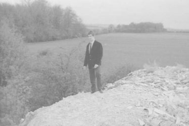 Ron Winter, standing on the asbestos dump with woods No. 1 & 2 in the background. c. 1960. | Photograph supplied by Ken Winter