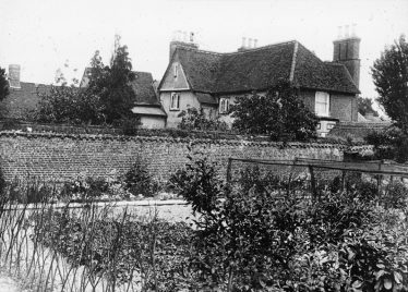 Lantern slide of a south west view of Sheen Manor House showing the old wing to the left and the outside of the walled garden.  Photo dated 1924 | Cambridge Antiquarian Society