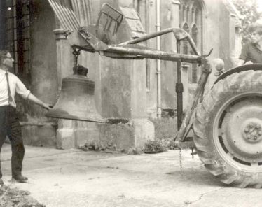 David Pepper on the tractor, with John Gipson holding the sixth bell David Pepper on the tractor, with John Gipson holding the sixth bell | Photograph supplied by John Gipson