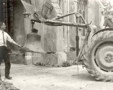 David Pepper on the tractor, with John Gipson holding the sixth bell | Photograph supplied by John Gipson