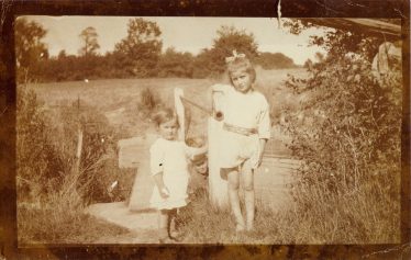 Evelyn, Sylvia and Norman (can you see him?) in a field near Meldreth Church in the 1920's Evelyn, Sylvia and Norman (can you see him?) in a field near Meldreth Church in the 1920's | Sylvia Gipson