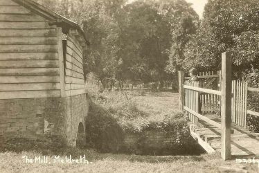 Mrs Sheldrick on the bridge at Flambards Mill Mrs Sheldrick on the bridge at Flambards Mill | Bell's Postcard supplied by Ann Handscombe