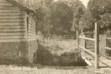 Mrs Sheldrick on the bridge at Flambards Mill | Bell's Postcard supplied by Ann Handscombe