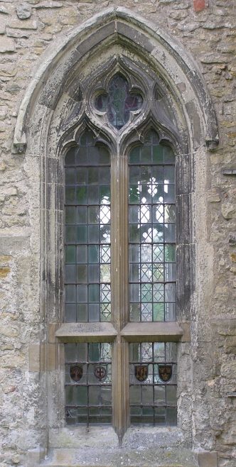 The northwest window of the chancel marks the next stage in which the geometric form of the oculus (circle) at the head of the window is now absorbed into continuously flowing tracery. The transom (horizontal bar) would have allowed the lower part of the window to have opening shutters, a feature common in secular building but unusual in churches. The northwest window of the chancel marks the next stage in which the geometric form of the oculus (circle) at the head of the window is now absorbed into continuously flowing tracery. The transom (horizontal bar) would have allowed the lower part of the window to have opening shutters, a feature common in secular building but unusual in churches. | Peter Draper