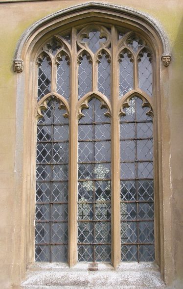 South aisle window with so-called Perpendicular tracery in which the head of the window is made up of rectilinear panels and vertical mullions run through to the window arch. The shallow four-centred arch (the profile of the arch is struck from four different compass points) is typical of the 15thc. | Peter Draper