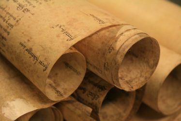 Early manorial court rolls were made of membranes of parchment stitched together at the top. | Essex Record Office