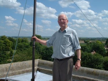 John pictured on top of Holy Trinity Church tower, June 2003