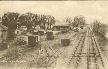 View of Meldreth Station Goods Yard 1925 - 35.  The stables are in the top left of the photo (see detail photo above).  The horse powered turn-table can be seen near the bottom lefthand corner of the photo. | J Bishop postcard