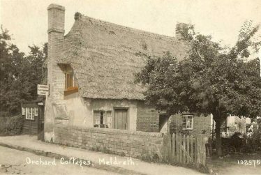 Bramble Cottage ~1930. The cottage is named Orchard Cottage on this postcard. Note the sign for Mr Norman, cobbler. The photo clearly shows that the cottage housed 3 families. Bramble Cottage ~1930. The cottage is named Orchard Cottage on this postcard. Note the sign for Mr Norman, cobbler. The photo clearly shows that the cottage housed 3 families. | Bells Postcard