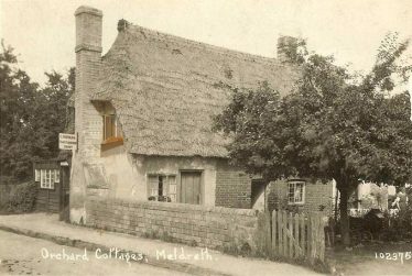 Bramble Cottage ~1930.  The cottage is named Orchard Cottage on this postcard.  Note the sign for Mr Norman, cobbler.  The photo clearly shows that the cottage housed 3 families. | Bells Postcard