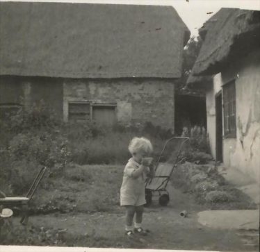 Roger Winter in Jarman's Yard ~1940 - 45. Orchard Cottage is to the right with Bramble Cottage in the background Roger Winter in Jarman's Yard ~1940 - 45. Orchard Cottage is to the right with Bramble Cottage in the background | Roger Winter