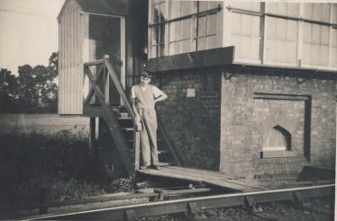 Keith Fost standing on the steps to the signal box in 1936 | Enid Martin