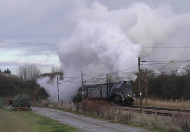 The Sir Nigel Greasley en-route for London passing through the railway bridge below Meldreth Station in 2009 | Paula Jones