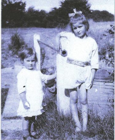 Sylvia with her younger sister Evelyn.  Her brother Norman can just be seen between the sisters. | Photo supplied by Joan Gipson and Chris Duguid