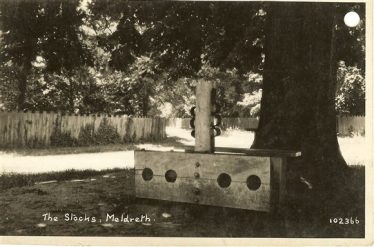 The Stocks on Marvell Green, Meldreth, pictured c. 1930 | Bell's Postcard supplied by Meldreth WI