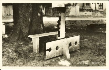 The stocks and whipping post, c. 1965 | Postcard supplied by Meldreth WI